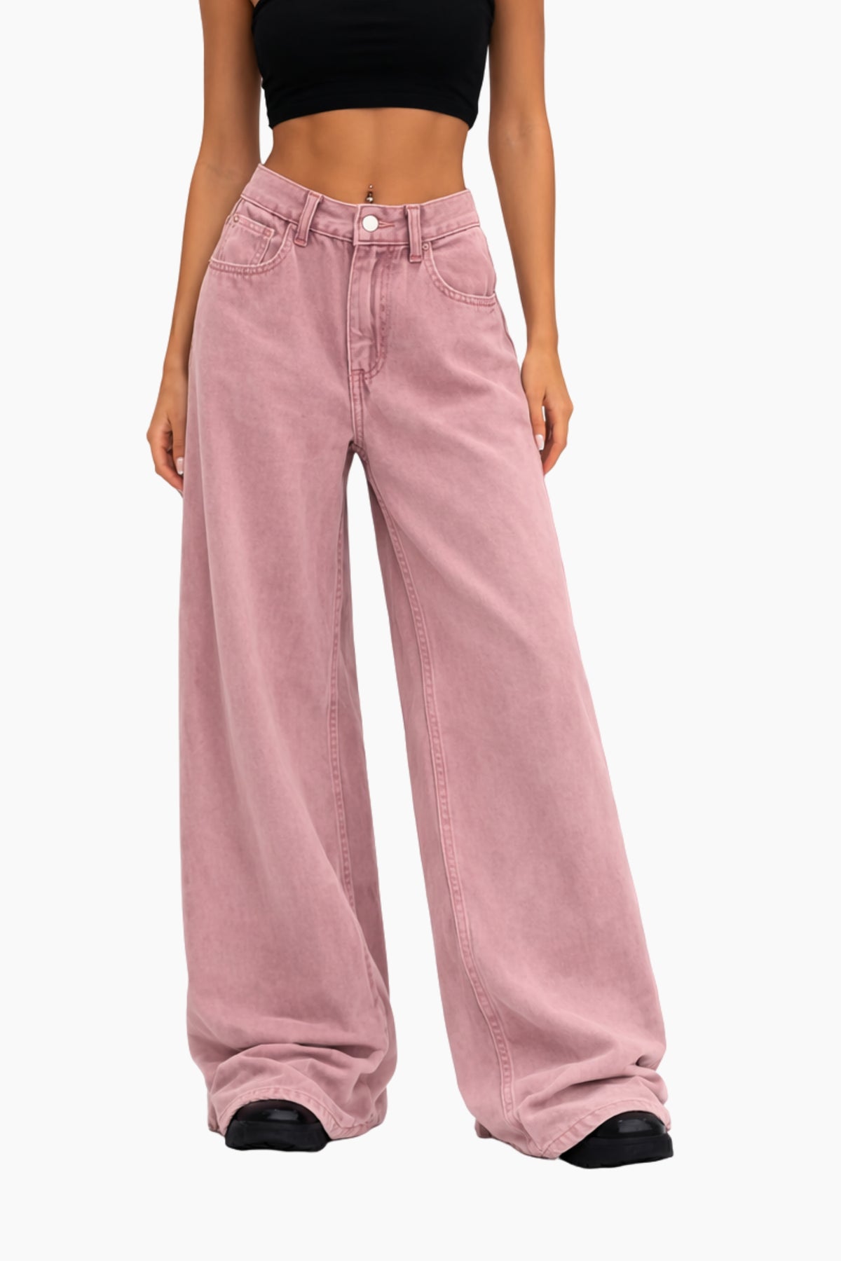Person wearing pink wide-leg jeans on a white background
