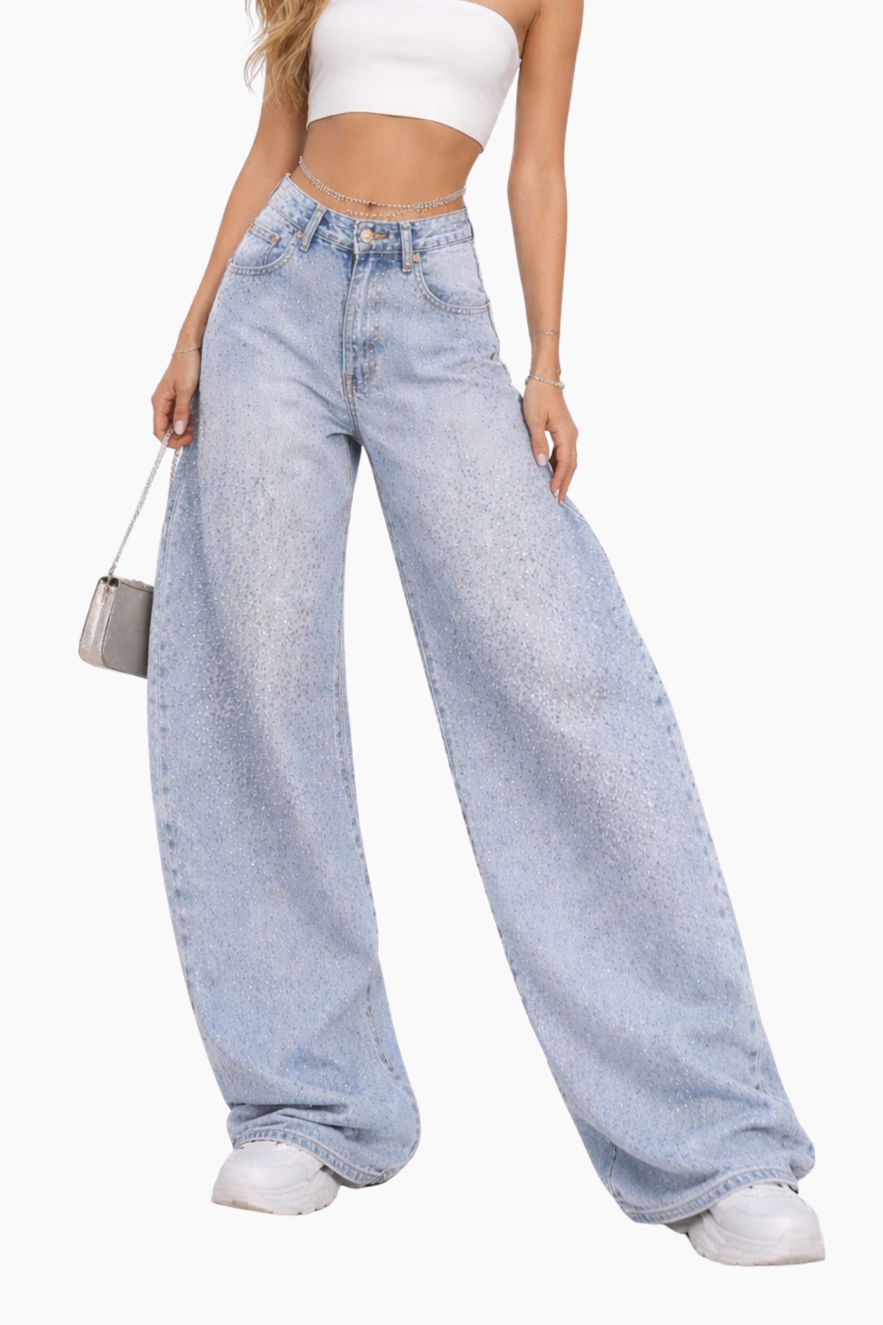 Person wearing light blue wide-leg jeans and a white top on a white background