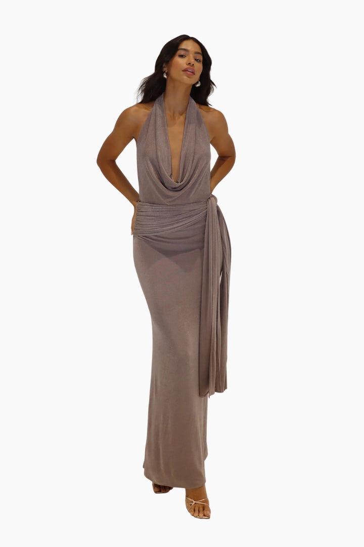 Woman wearing a long, flowing dress on a white background