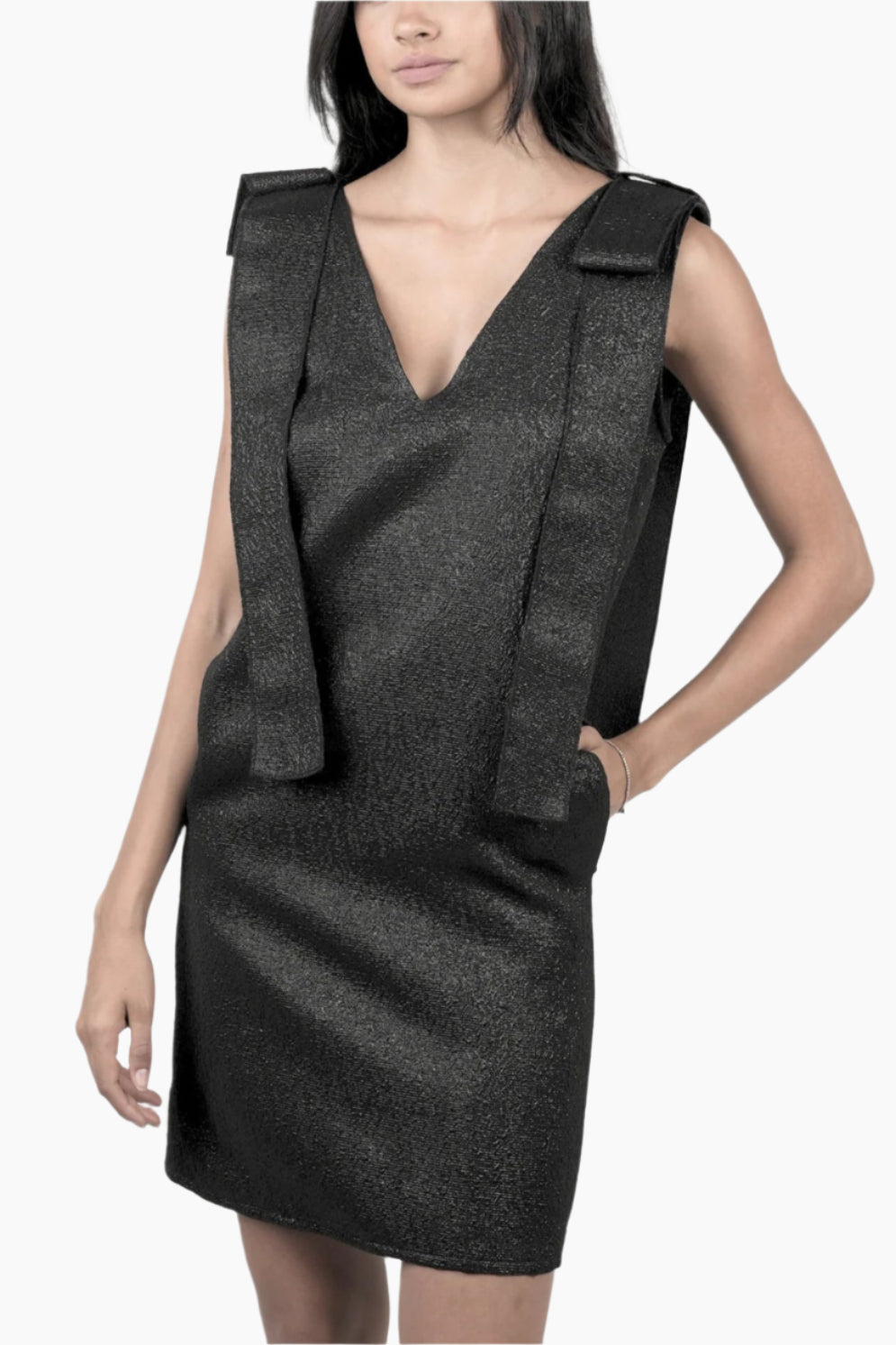 Woman wearing a black sleeveless dress with a unique design 