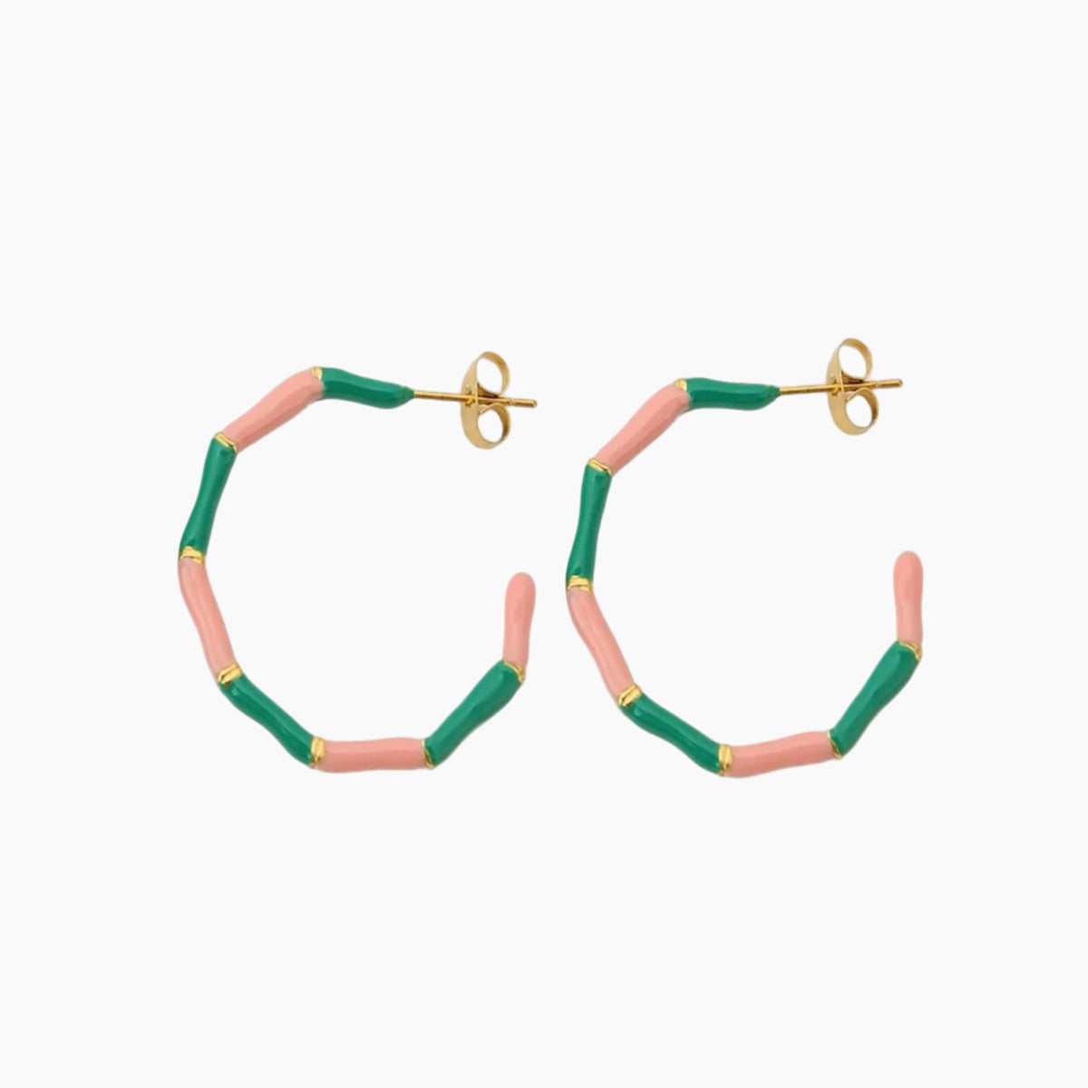 Hoop earrings with pink and green bands on a white background