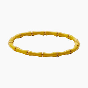 Yellow bamboo bracelet on a white background