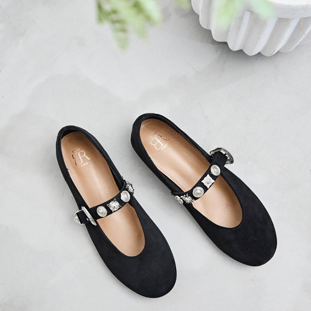 Pair of black flats with embellishments 