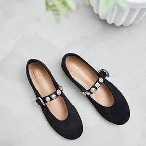 Pair of black flats with embellishments 