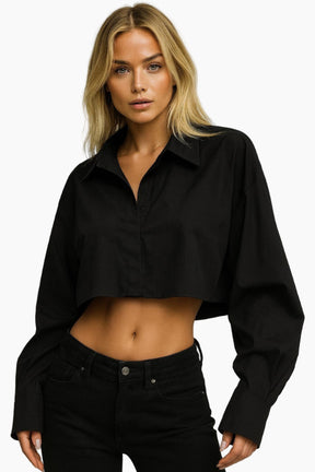 Woman wearing a black cropped shirt =