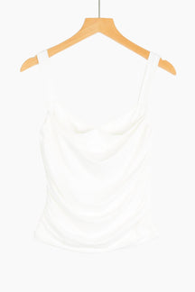 White tank top on a wooden hanger 