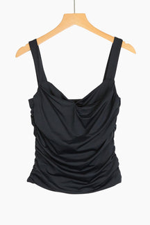 Black draped tank top on a wooden hanger
