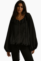 Black hooded jacket worn by a model =