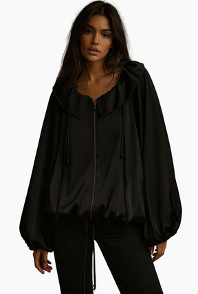 Black hooded jacket worn by a model =