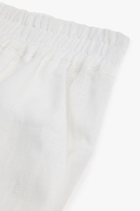 Close-up of white fabric with a subtle texture on a white background