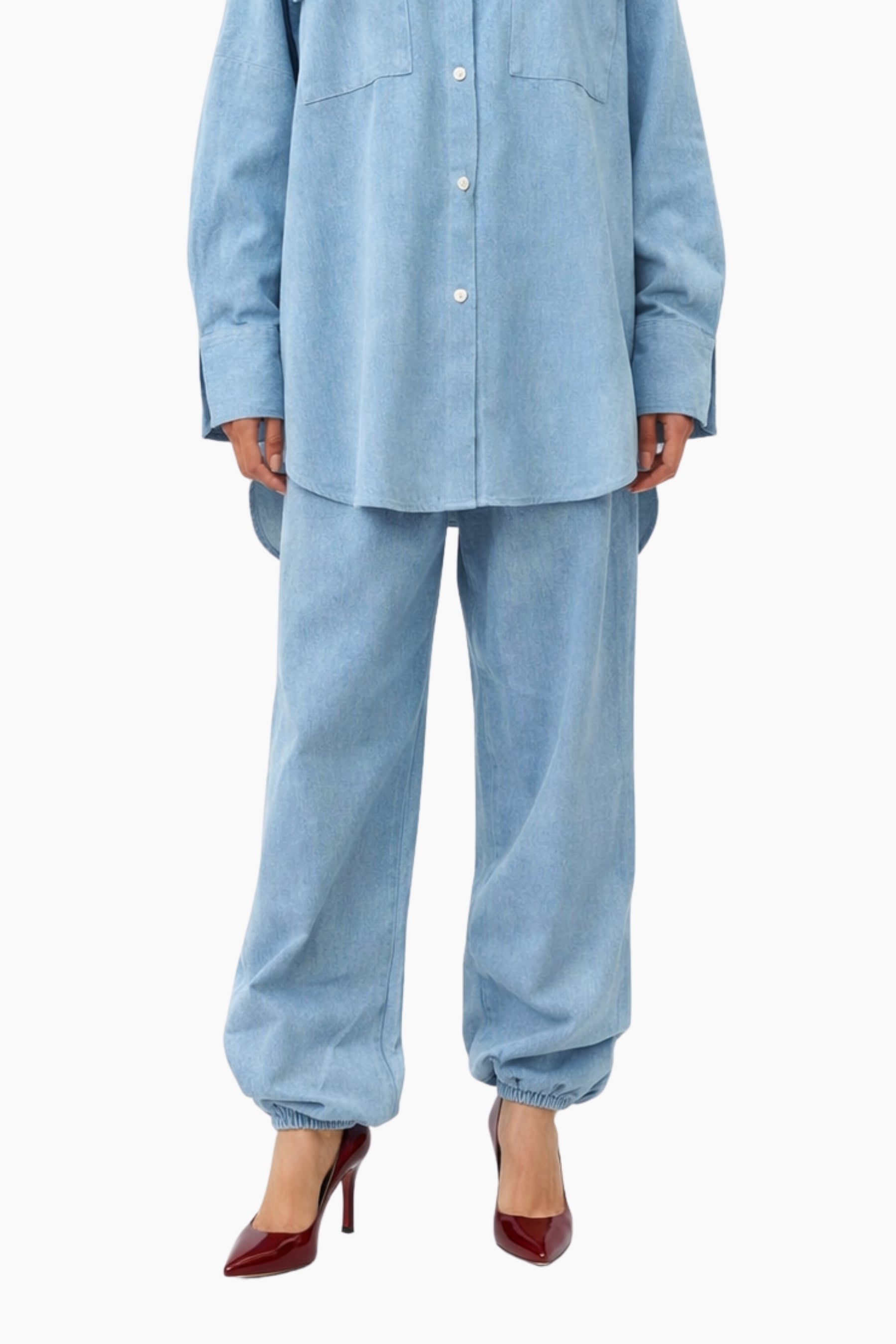 Light blue denim outfit with a shirt and pants on a white background