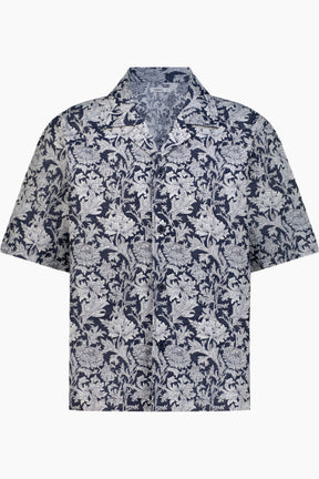 Floral patterned shirt in light blue and navy.