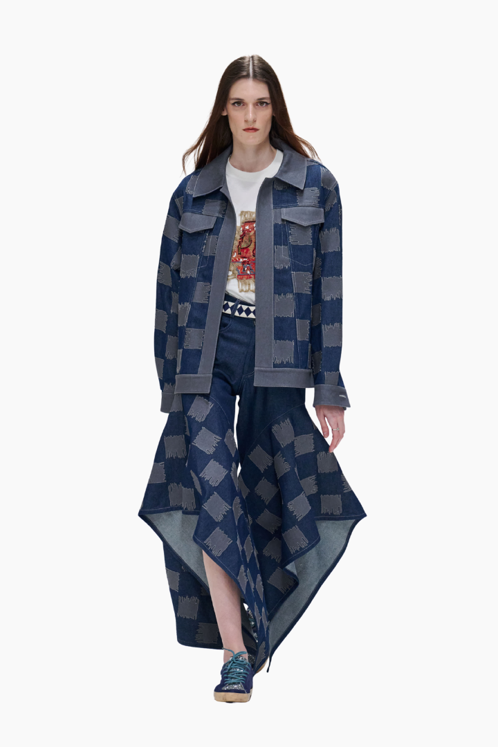 Model wearing a blue checkered outfit with a white background