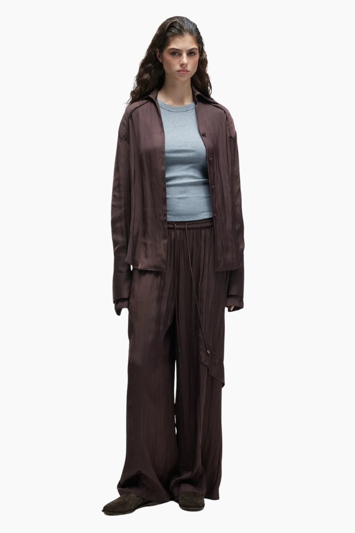 Woman  wearing a Silky Layers Trouser and mocha brown long sleeve shirt