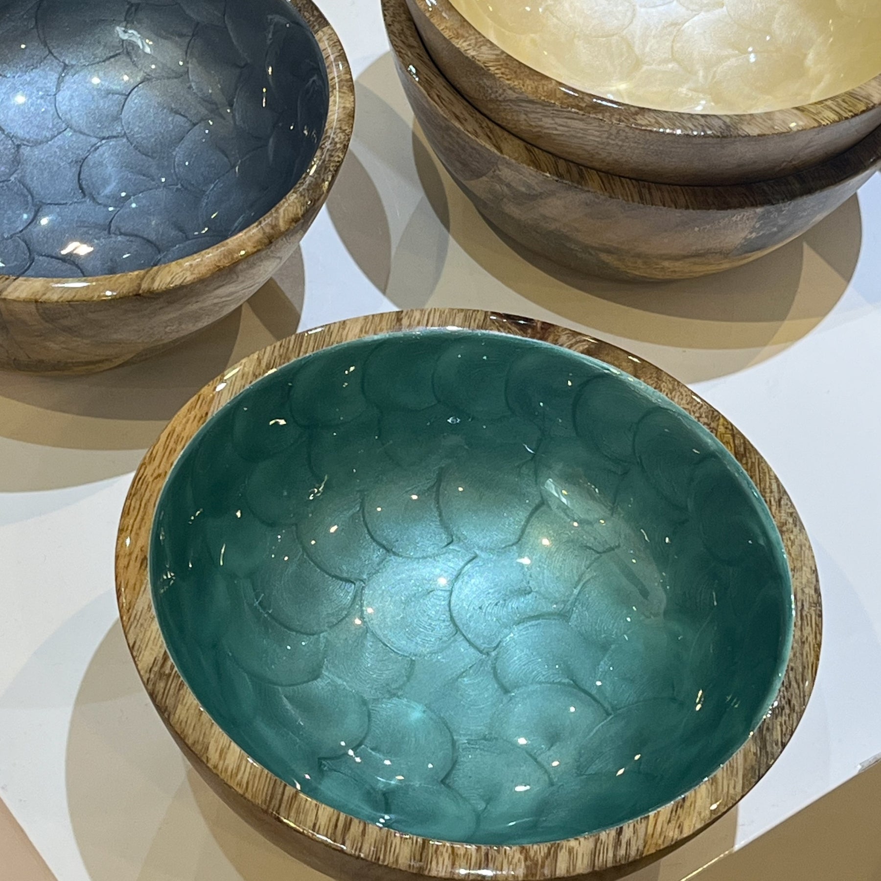 Three ceramic bowls with textured surfaces on a white background