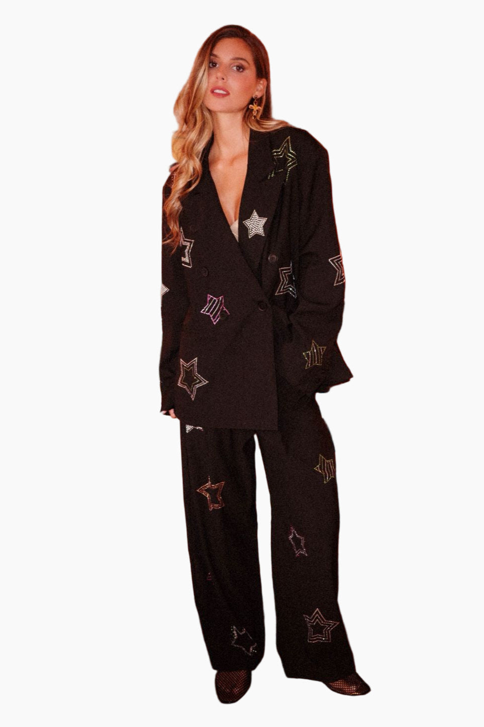 Woman wearing a black suit with star patterns