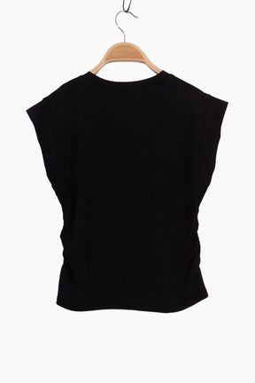 Black sleeveless top on a wooden hanger 