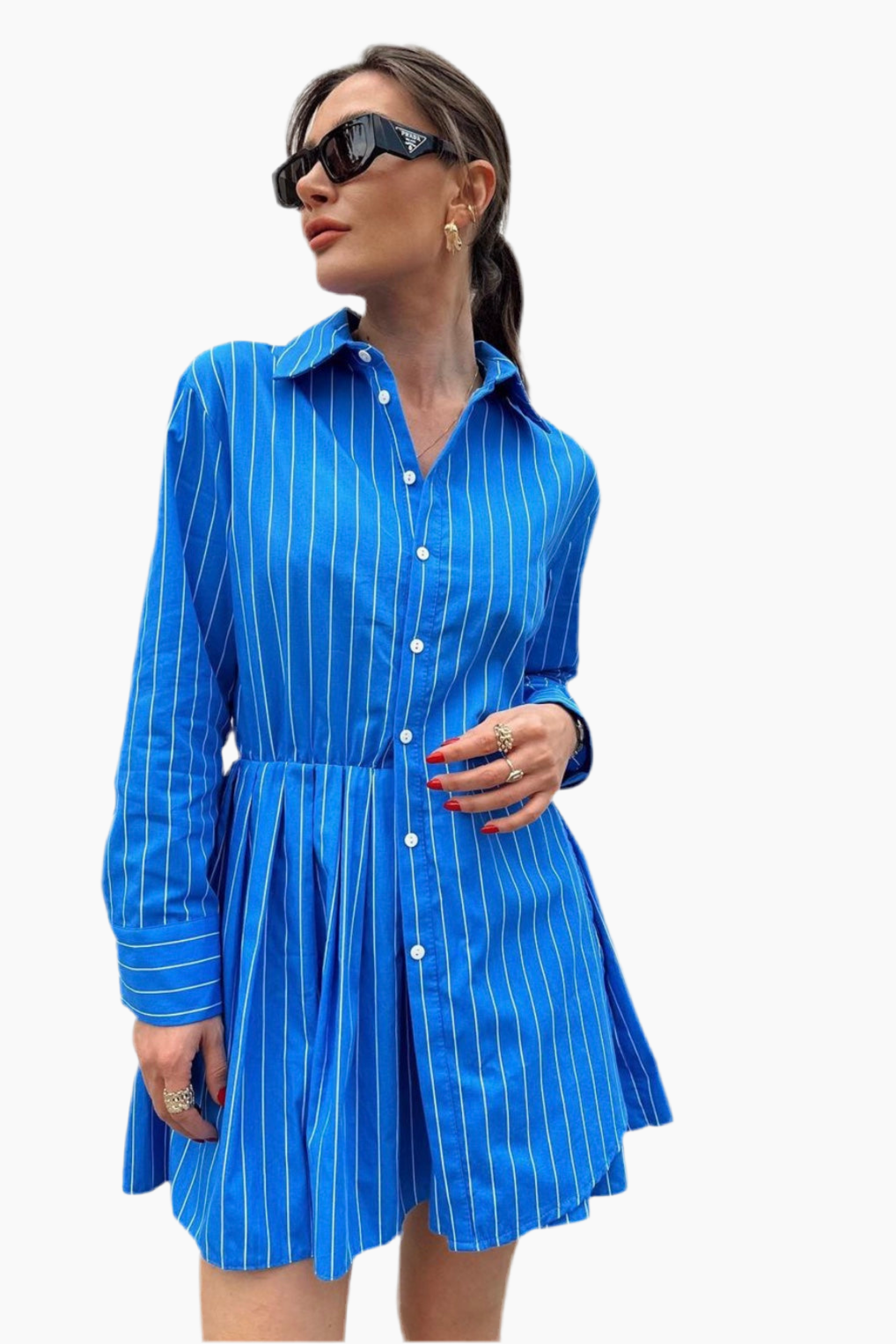 Woman wearing a blue striped dress on a white background
