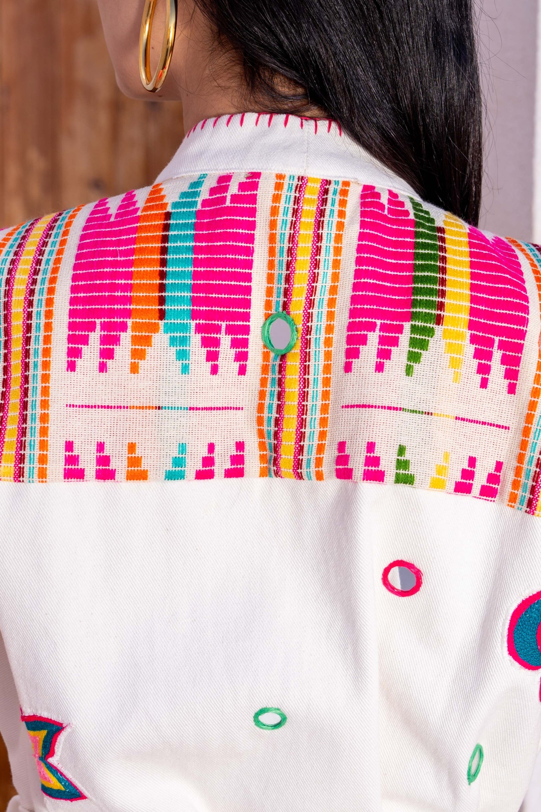 Colorful patterned jacket with a white background