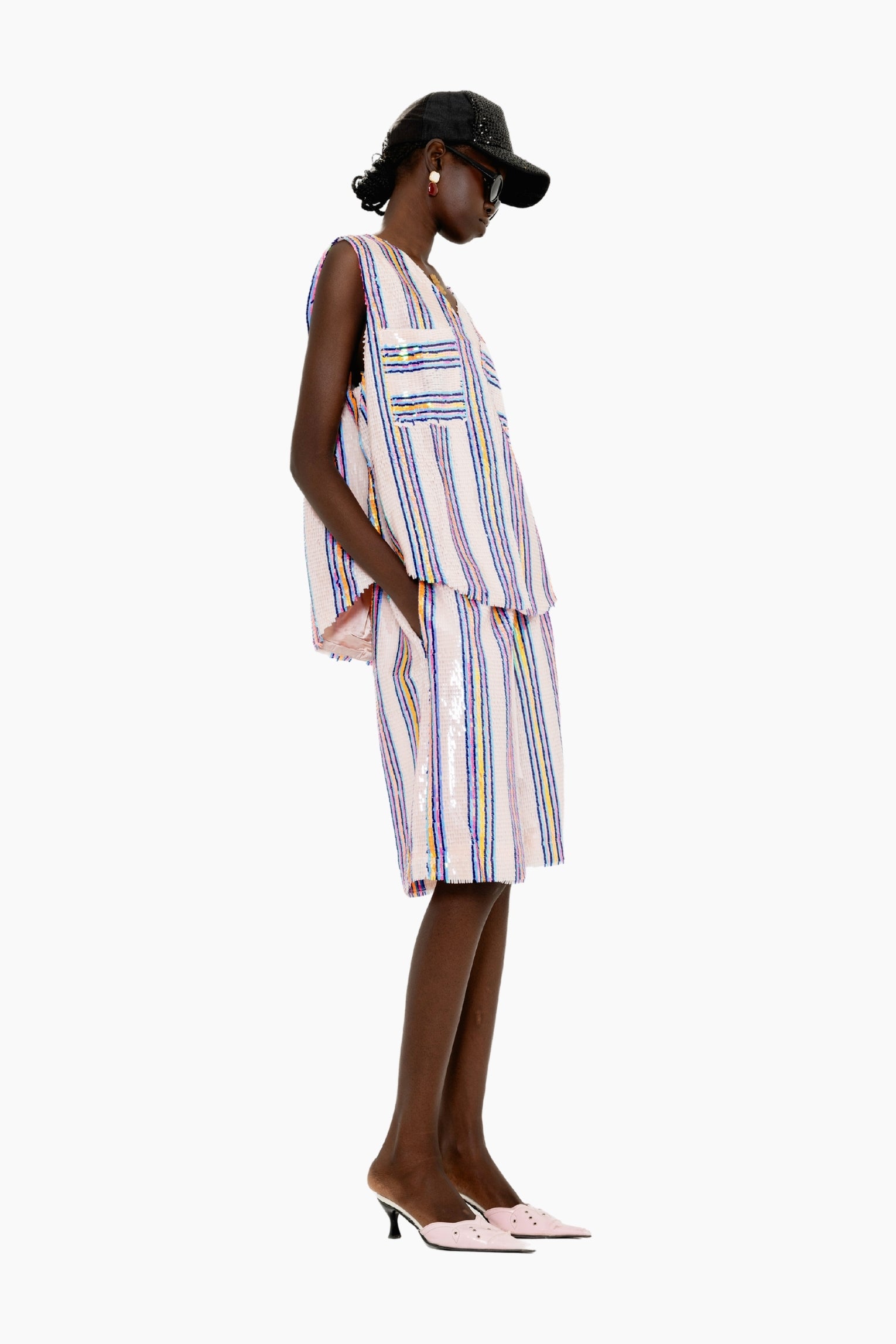 Eye-catching featuring knee-length relaxed-fit shorts with multicolored vertical sequin stripes on a textured base.