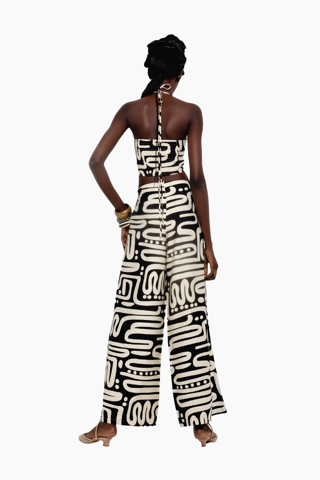 Woman wearing a patterned jumpsuit 