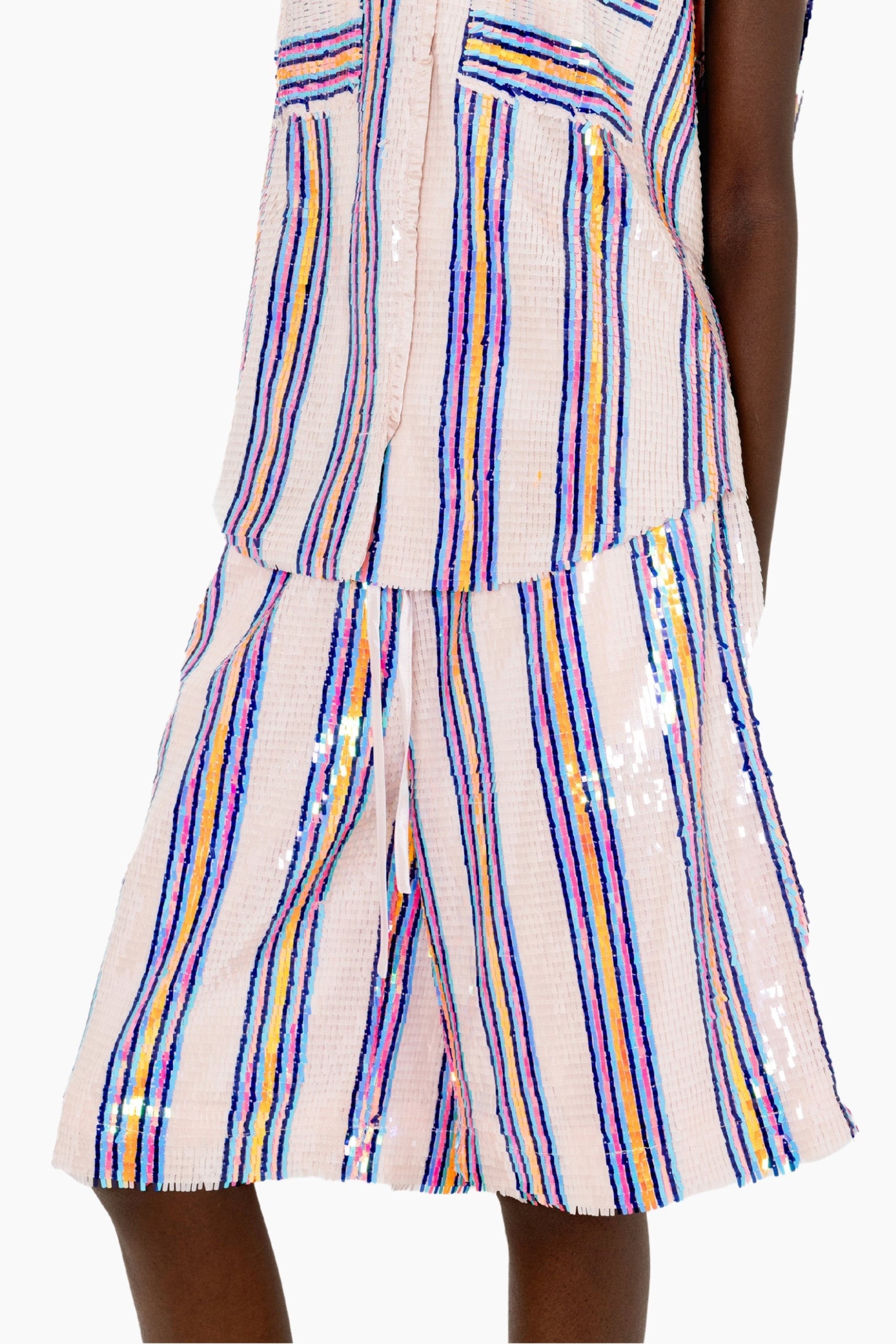 Eye-catching featuring knee-length relaxed-fit shorts with multicolored vertical sequin stripes on a textured base.