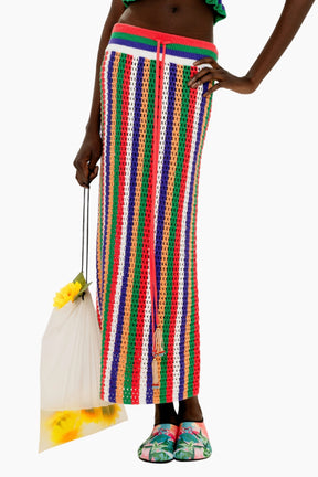 Person wearing a Colorful striped crochet skirt with a fitted silhouette and tassel detail.