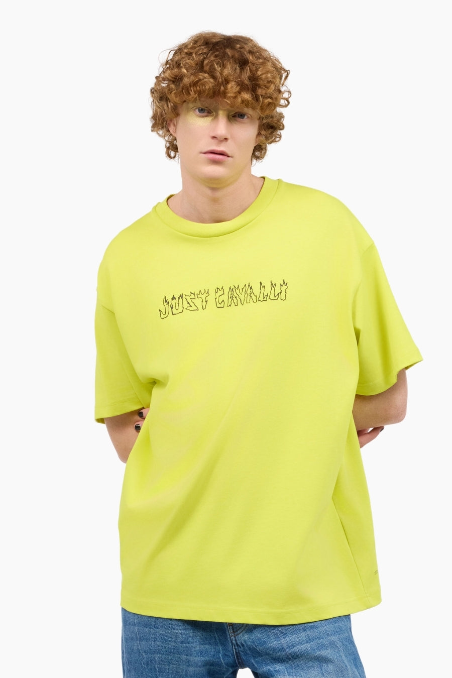 Person wearing a bright yellow t-shirt with text