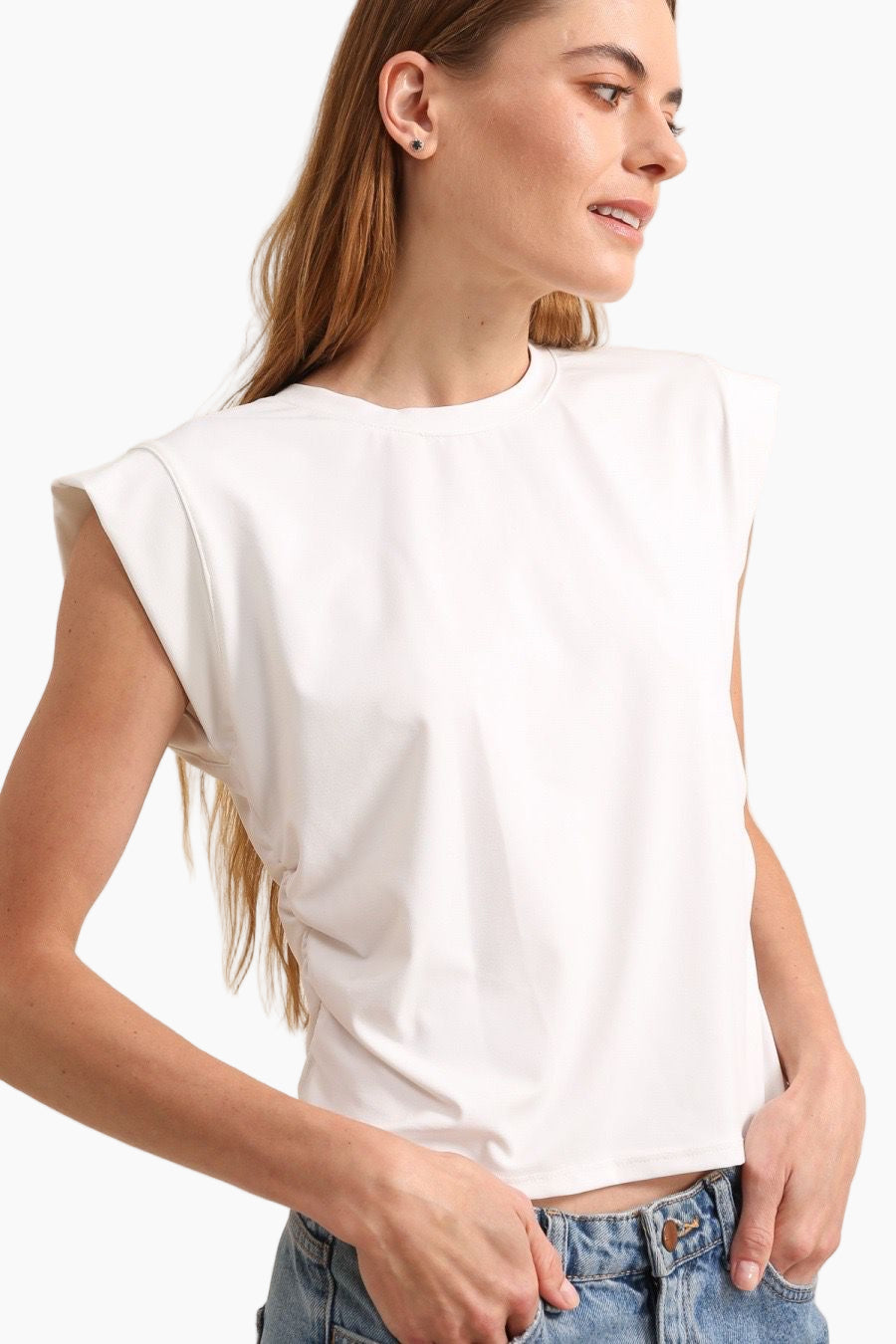 Woman wearing a white sleeveless top 