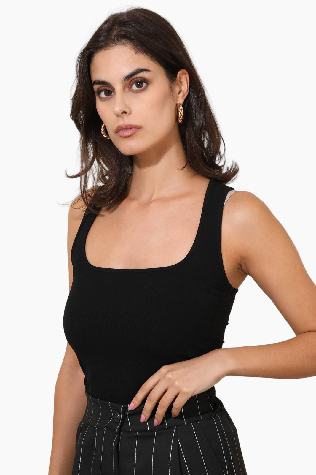 Woman wearing a black sleeveless top 