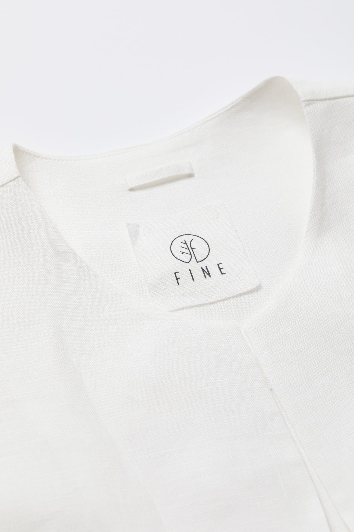 White shirt with 'FIND' logo on a white background
