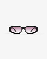 Black sunglasses with pink lenses on a white background