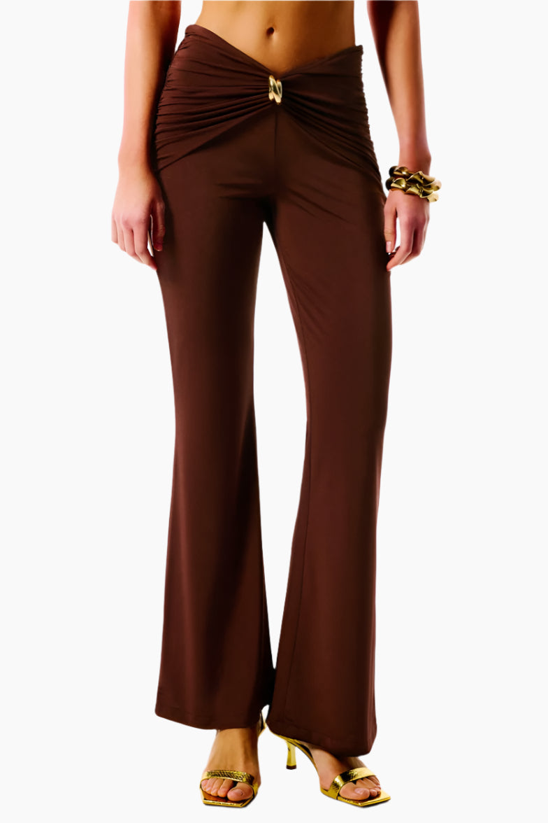 Brown wide-leg pants with a gold belt 