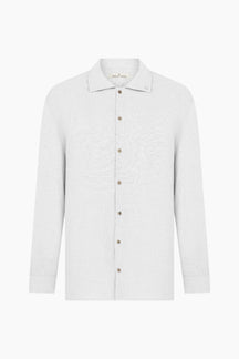 White shirt with brown buttons 