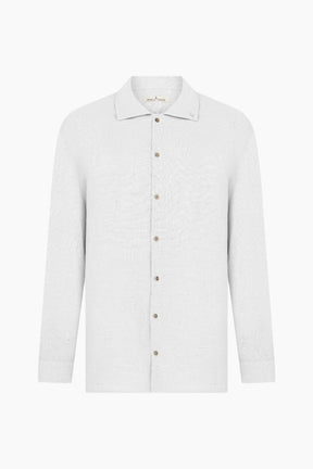 White shirt with brown buttons 