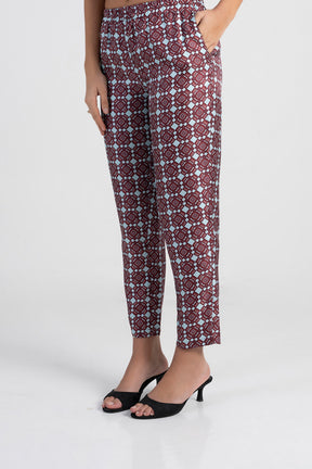 Patterned pants worn by a person on a white background