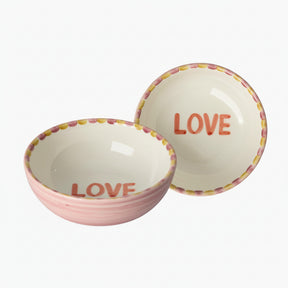 Two ceramic bowls with 'LOVE' text 