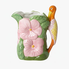 Ceramic pitcher with pink flowers and a bird handle 