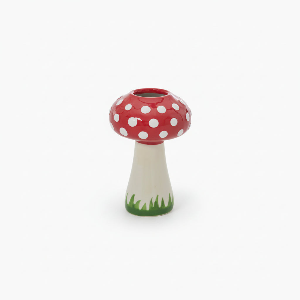 Mushroom-shaped vase with a red cap and white polka dots.