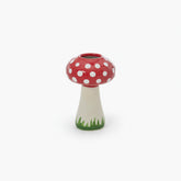 Mushroom-shaped vase with a red cap and white polka dots.