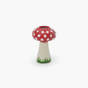 Mushroom-shaped vase with a red cap and white polka dots.