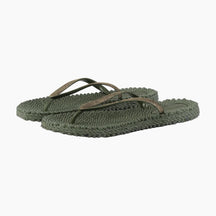 Green crochet sandals on a white background