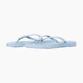 Light blue flip-flops on a white background
