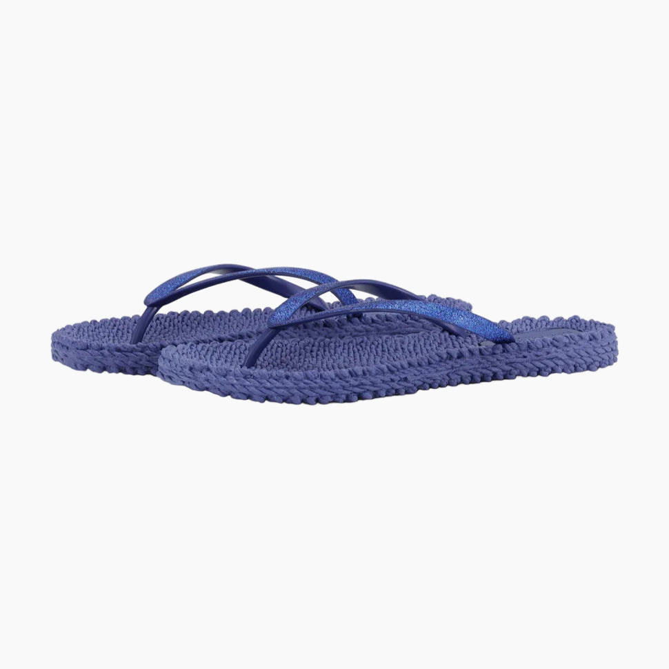 Pair of blue flip-flops on a white background