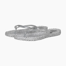 Silver flip-flops with rhinestone embellishments on a white background