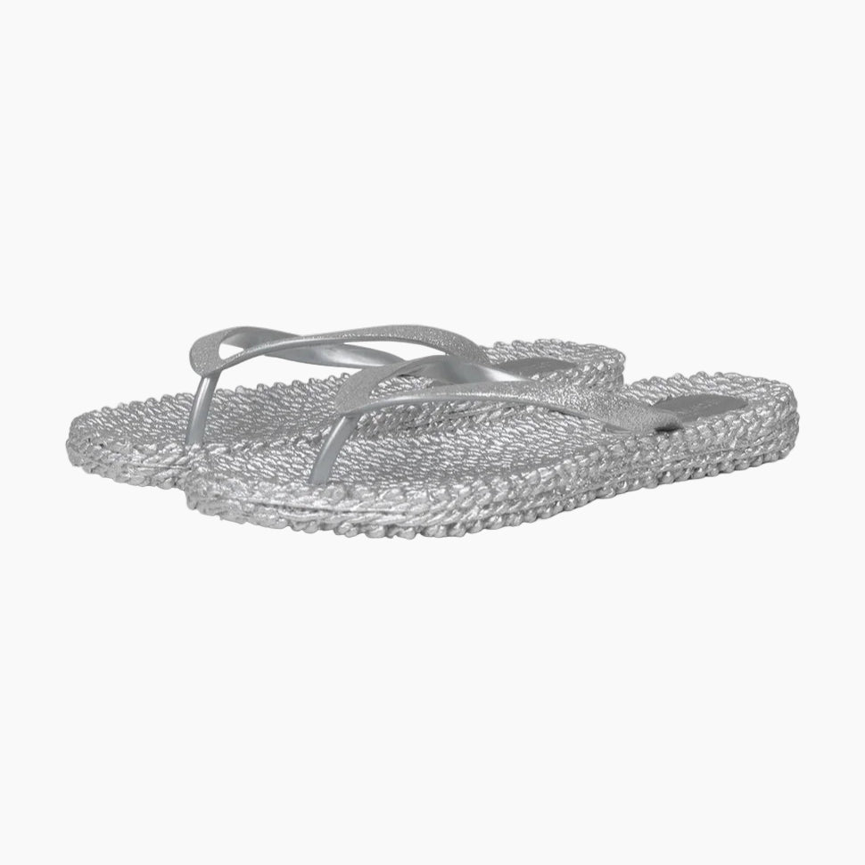 Silver flip-flops with rhinestone embellishments on a white background