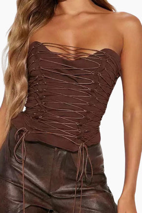 Brown strapless top with lace-up details on a white background
