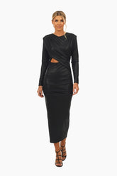 Woman wearing a black long-sleeve dress with cut-out design 