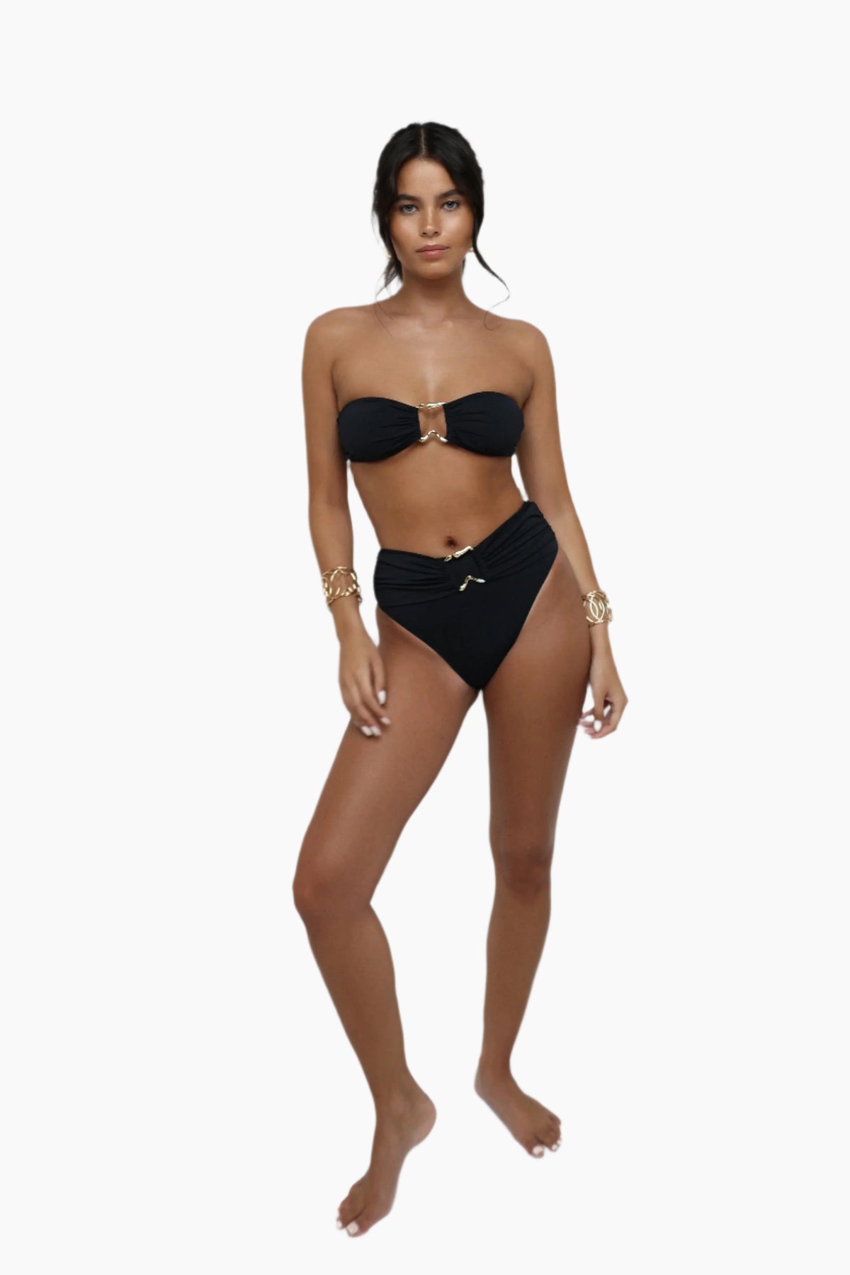 Woman wearing a black bikini on a white background