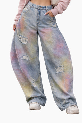 Tie-dye jeans worn by a person on a white background